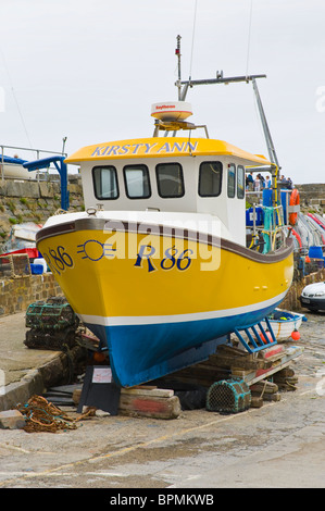 Local fishing boat on harbour slipway for repairs the coastal town of New Quay, Ceredigion, West Wales, UK Stock Photo