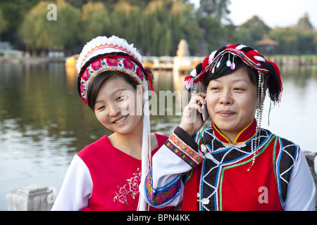 Portrait of two Chinese women wearing traditional costumes, Bai minority, Dianchi Lake, Daguan Park, north-west of Kunming City, Stock Photo