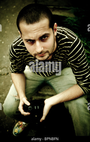 Vinatage portrait of a young photographer looking up. Stock Photo