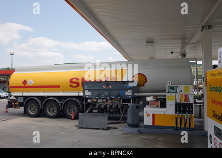 Luxembourg, Europe. Shell oil tanker delivering petrol to a filling station Stock Photo