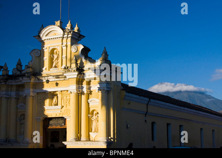 Central America, Guatemala, Antigua. San Pedro Church in the town of Antigua and Vulcan de Agua. Stock Photo