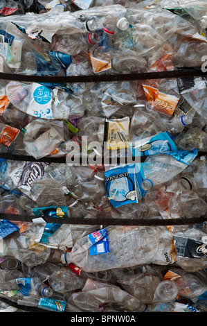 Bales of clear plastic soft drink bottles for recycling at a recycling plant Stock Photo