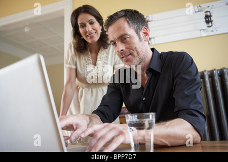 Couple looking to computer Stock Photo