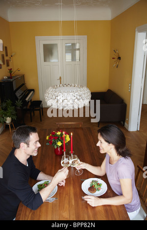 Couple having dinner at home Stock Photo