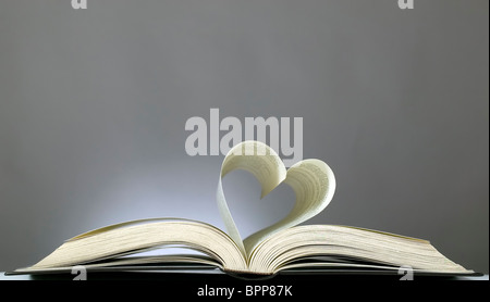 Book with opened pages and shape of heart Stock Photo