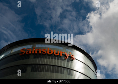 Sainsbury's supermarket sign on a modern contemporary glass and steel building in High Wycombe town centre Bucks UK Stock Photo