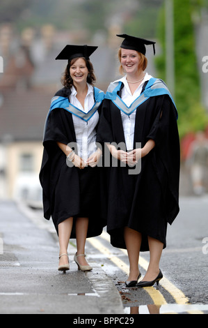 Two students on their graduation day in the rain at Exeter, Devon, UK July 2007 Stock Photo