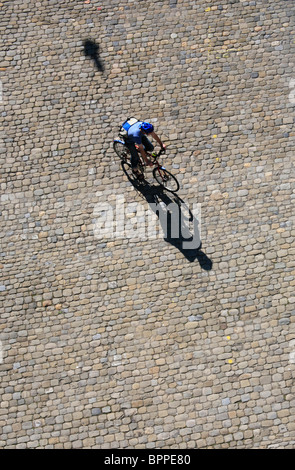 Aerial view of a cyclist on cobbled street, Bern, Switzerland