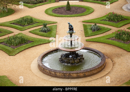 Looking down on formal gardens with water fountain at Osborne House, East Cowes, Isle of Wight, Hampshire UK in May - Osbourne House Stock Photo
