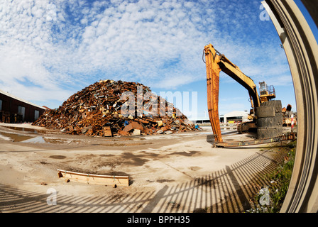 Scrap metal piled up on Liverpool Docks ready to be exported. Stock Photo