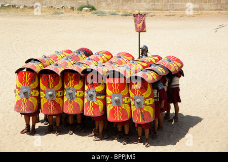 Actors playing roman legionaries soldiers in the tortoise tactic, Jerash, Jordan Stock Photo