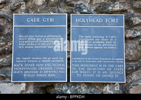 Holyhead, Isle of Anglesey, North Wales, UK. Information plaque outside Caer Gybi Roman fort walls Stock Photo