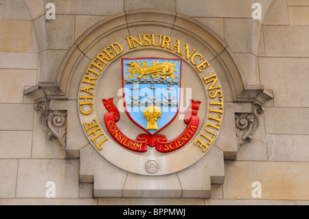 The Chartered Insurance Institute coat of arms on the headquarters building in City of London England UK Stock Photo