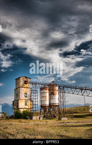 Old rock crushing machines in a abandoned quarry Stock Photo