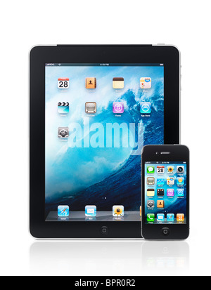 Apple iPad 3G tablet computer and iPhone 4 smartphone with desktop icons on their displays isolated on white background. HQ Stock Photo