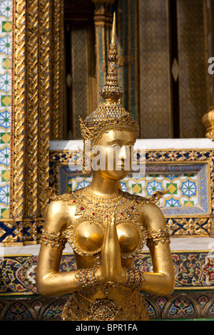 Gold statue, Wat Phra Kaeo, Grand Palace, Bangkok, Thailand Stock Photo