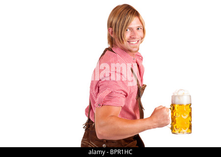 Bavarian man shows biceps muscles and holds Oktoberfest beer stein.  Isolated on white background. Stock Photo