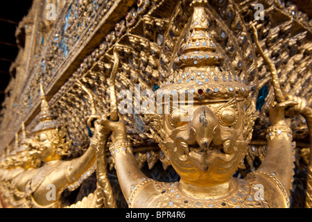 gold Kinnara statues, Temple of the emerald Buddha, Wat Phra Kaeo, Grand Palace, Bangkok, Thailand Stock Photo