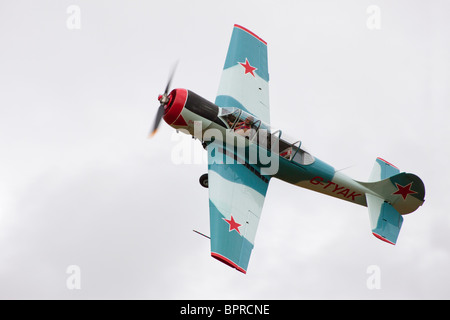 Yakovlev Yak-52 G-TYAK in flight at Breighton Airfield Stock Photo