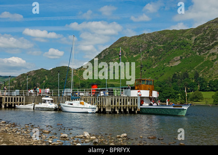 The lake pleasure Steamer boat Raven moored at Glenridding Pier on Ullswater in summer Cumbria England UK United Kingdom GB Great Britain Stock Photo