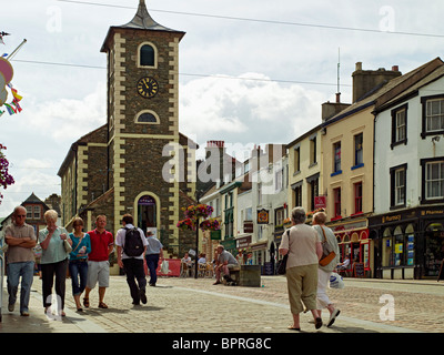 People tourists visitors at The Moot Hall in summer Market Square Keswick Cumbria England UK United Kingdom Great Britain Stock Photo