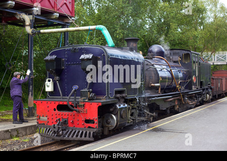 Steam locomotive being filled with water on the Llangollen Railway ...