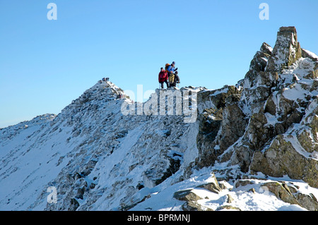 Hill walkers on Striding Edge, Helvellyn, in the English Lake District Stock Photo