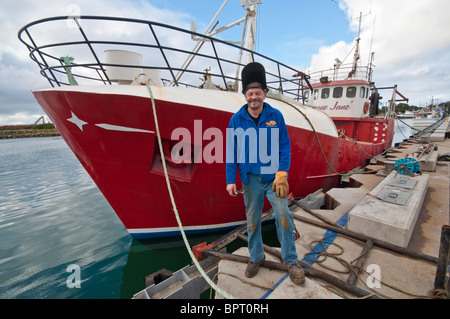 Ship's engineer, George Currie with the fishing boat, Vivienne Jane at Portland, Victoria Stock Photo