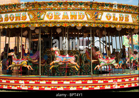 Steam Galloping horse carousel, fairground ride at the Great Dorset steam fair 2010, England Stock Photo