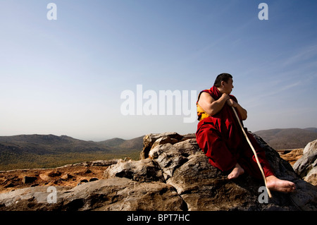 A Monk sitting on the Eagle (Vulture) Peak where Shakyamuni Buddha preached the Lotus Sutra, Rajgir, Rajagriha, Bihar, India. Stock Photo