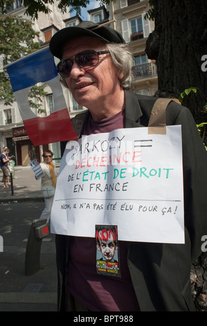 Paris, France, 'League of Rights of Man' Protests Against  Gypsy Expulsions by French Government, WOman Holding Protest Sign on Street Stock Photo