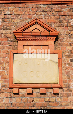 Sandon Dock name inscribed in a sandstone block in the gate pillar in the entrance. Stock Photo