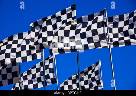Checker flag against blue sky