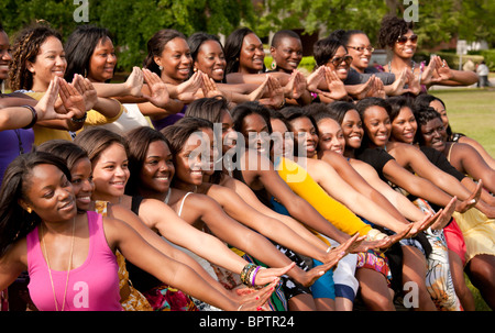 Tallahassee, Florida, Delta Sigma Theta Sorority posing at 2010 graduation day May first. Second row is making the Delta sign. Stock Photo