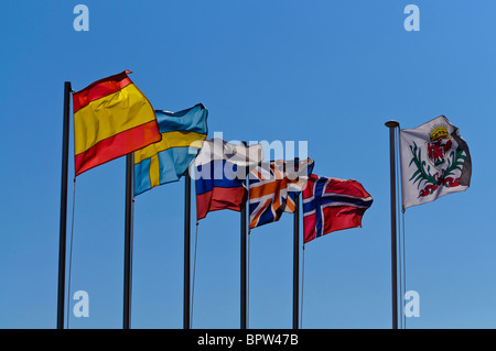 Flags of Spain, Sweden, Russia, UK, Norway and the flag for Nice backlit by the sun. Stock Photo