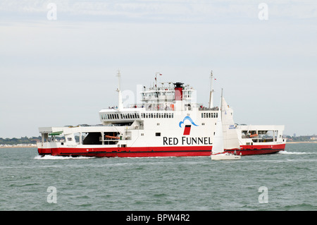 The Red Falcon a roro ferry of the Red Funnel company approaching Southampton & a yacht Stock Photo