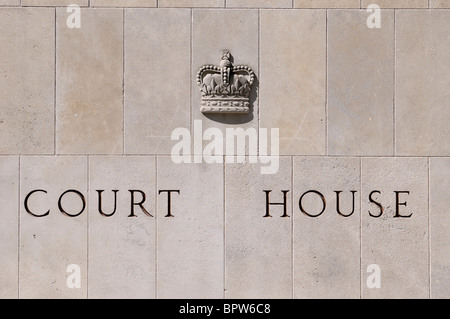 Court house carved on stone blocks with royal emblem Stock Photo