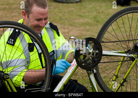 Police officers are security tagging bicycles as antitheft measure during Mayor of London’s Sky Ride Ealing Stock Photo