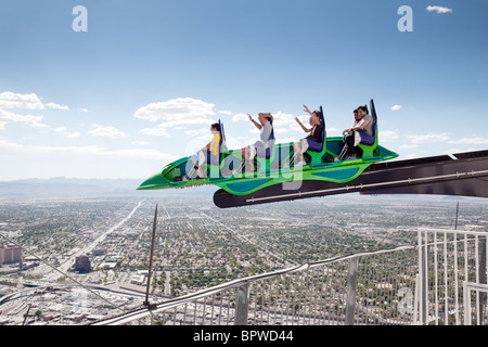 people enjoying the X-scream ride at the top of the Strat, or Stratosphere hotel Tower & Casino, Las Vegas USA Stock Photo