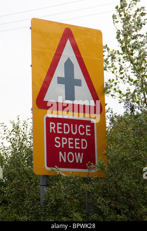 'Reduce Speed Now' road sign Stock Photo