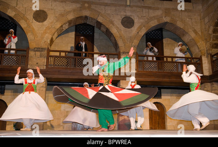 whirling dervish Sufi dancers in motion at performance in Cairo Egypt Stock Photo