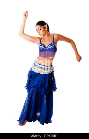 Arabic belly dancer harem woman in blue with silver dress and head jewelry with gem dancing twirling her arms Stock Photo