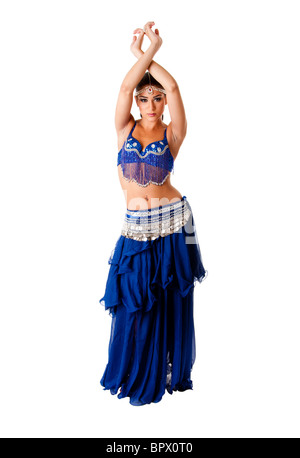 Beautiful Arabic belly dancer harem woman in blue with silver dress and head jewelry with gem dancing arms in air, isolated. Stock Photo