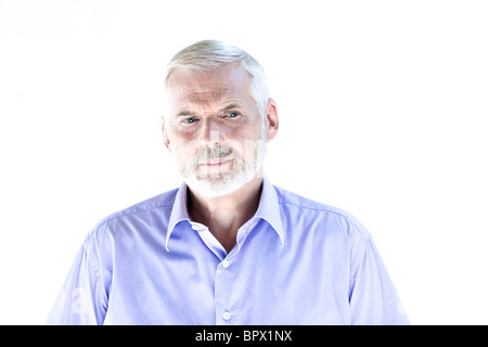 caucasian senior man portrait frown sullen isolated studio on white background Stock Photo