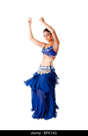 Beautiful Arabic belly dancer harem woman in blue with silver dress and head jewelry with gem dancing swirling skirt, isolated. Stock Photo