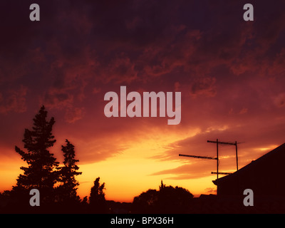 View of the tranquil, evening sky above the city after the storm. Toned image. Stock Photo