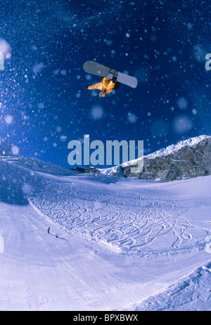 Snowboarder big air on Quarterpipe Stock Photo