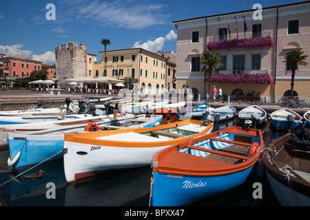 Harbour with small fishing boats in Bardolino, Lake Garda, Italy Stock Photo