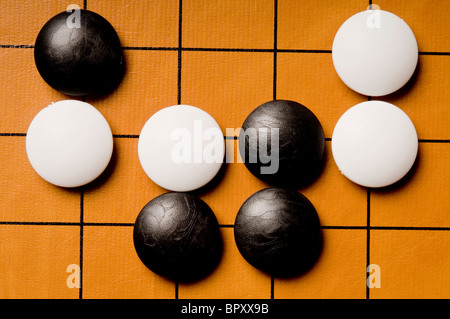board with a Go game in progress Stock Photo