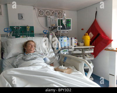 London England Private Intensive Care Unit Elderly Woman In Hospital Bed Stock Photo